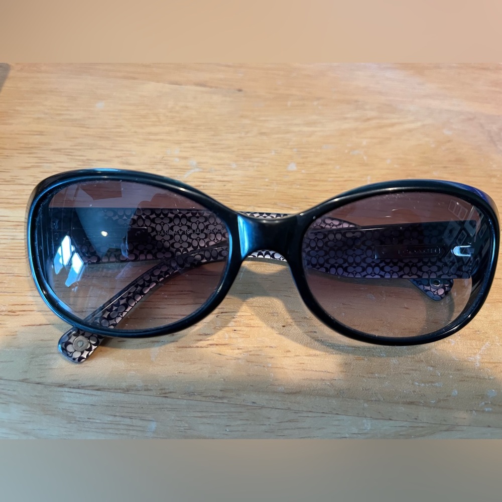 Coach women’s sunglasses. Gently used. Black frames, cat eye shape. With case.